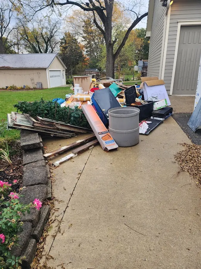 Dumpster being loaded with debris for 3 Yard Dumpster Rental in Schiller Park